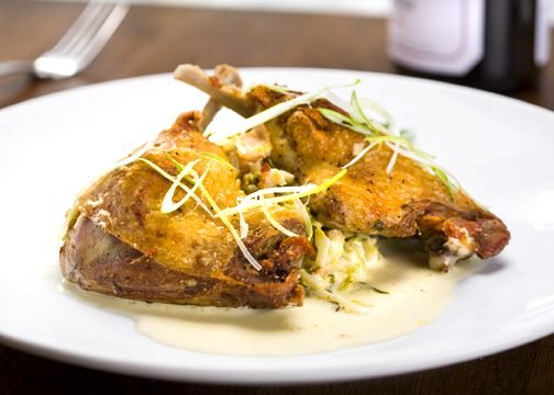 Roasted duck entrée photographed for restaurant menu